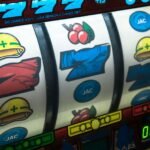 A close-up of a slot machine, displaying a hint on either casinos help or harm the economy.