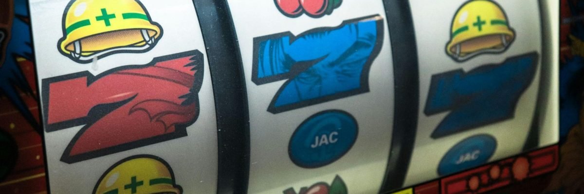 A close-up of a slot machine, displaying a hint on either casinos help or harm the economy.